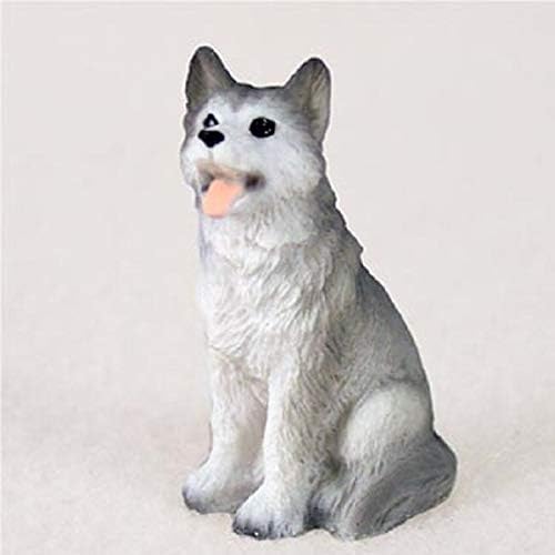 Conceitos de conversa em miniatura husky cinza e branco com olhos castanhos minúsculas estatuetas